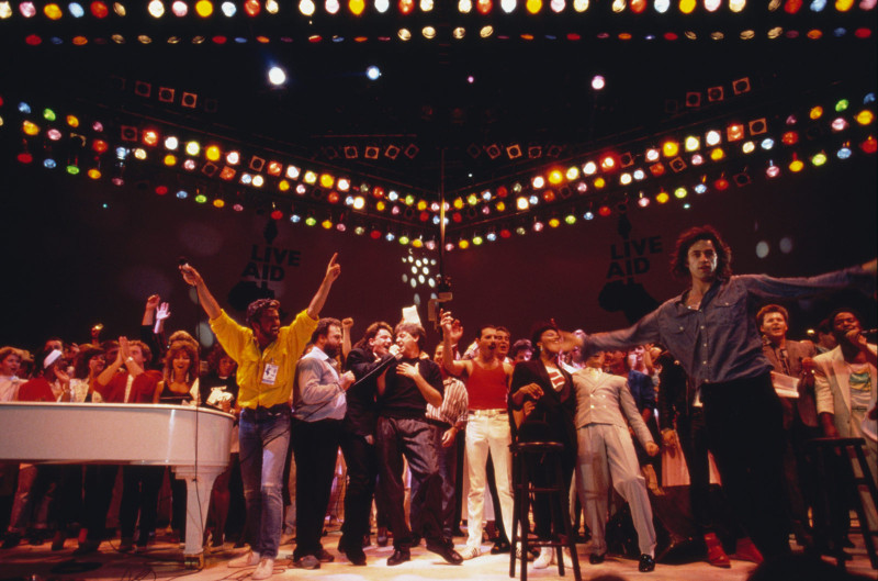 Mercury, at center in the red shirt, is joined by George Michael, Bono, Paul McCartney and others during the Live Aid show at Wembley Stadium. (Georges De Keerle/Getty Images)