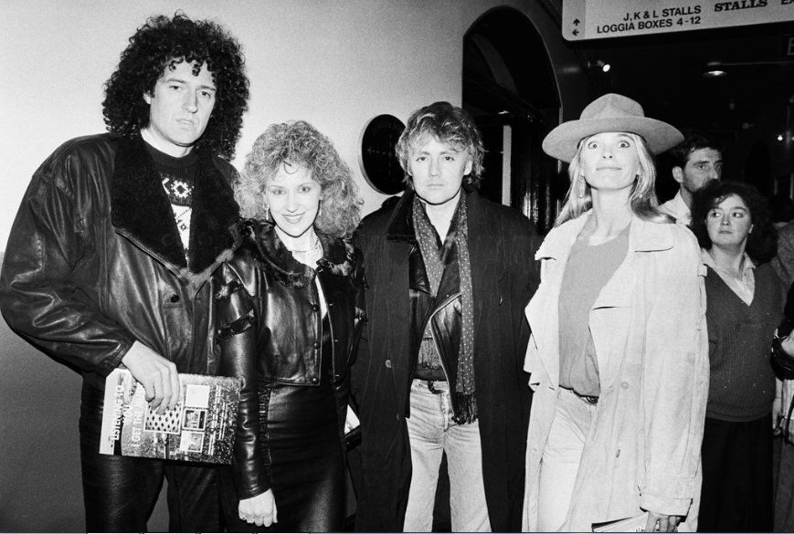 Brian May with his wife Anita Dobson and Roger Taylor with Debbie Leng at a charity concert of 'Tommy' at The Royal Albert Hall, London on 31 October 1989 (Photo © Alan Davidson)